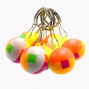 Colorful mini puzzle ball keychains in assorted vibrant plastic interlocking designs