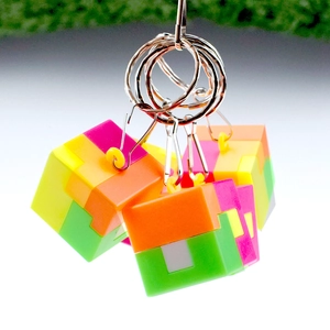 Colorful puzzle cube keychain with metal ring featuring bright interlocking pieces
