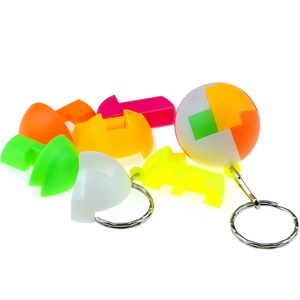 Close-up of colorful 3D puzzle ball keychain with disassembled plastic components