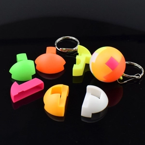 Detailed macro view of colorful 3D puzzle ball pieces with a metal keychain attachment