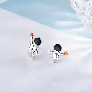 Astronaut silver stud earrings with black helmet and orange star planet design