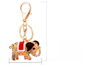 Close-up of golden elephant keychain with sparkling Czech rhinestones and cat eye stones