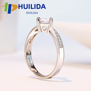 Macro detail of rose gold S925 silver ring featuring square zircon and heart cutout