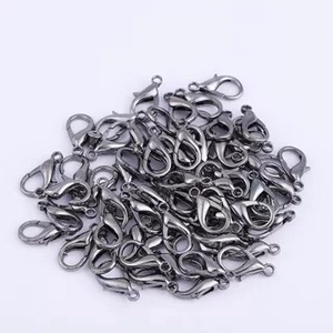 Close-up of bulk gunmetal black alloy lobster clasps for DIY jewelry making and necklaces