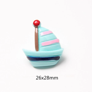 Detail of 26x28mm blue resin sailboat charm for DIY phone case decoration