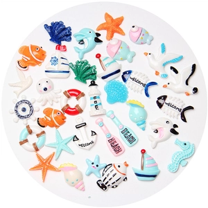 Mix of ocean-themed resin charms including anchors and starfish for DIY crafts decor