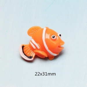 Macro shot of an orange resin clownfish accessory with 22x31mm dimensions marked