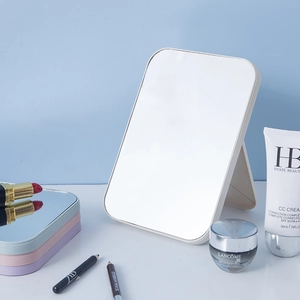 Foldable square desktop makeup mirror in white frame with vanity accessories