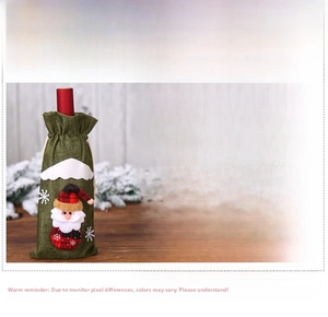 Detailed view of Christmas burlap wine bottle covers with Santa, snowman and elk designs