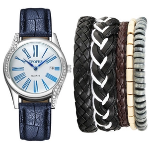 Detail of blue quartz watch with crystal bezel and stackable multi-color leather bracelets