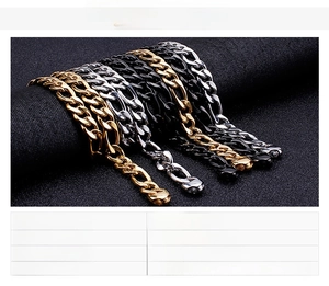 Macro shot of punk style stainless steel curb chains in gold, black, and steel finish