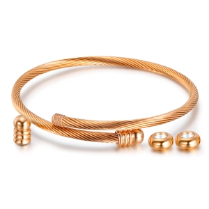 Three-piece rose gold twisted wire cable bracelet with matching metallic bead accents