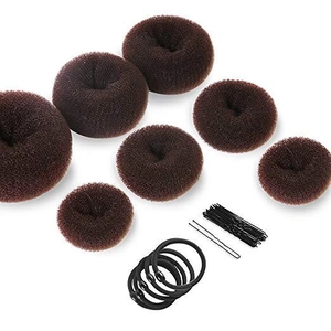 Brown hair donut bun maker set with black elastic bands and bobby pins on white background