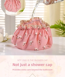 Pink waterproof shower cap with unicorn print showing water-bearing weight capacity