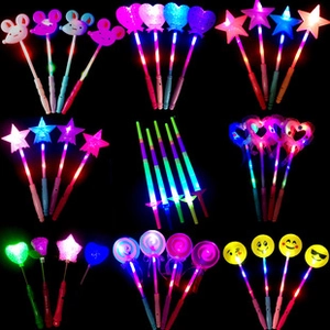 Macro view of glowing glow sticks in heart, star, and lollipop shapes for party decor