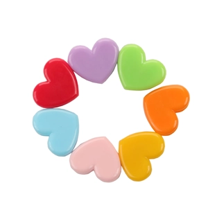 Detailed view of colorful heart-shaped plastic clips in seven vibrant transparent colors