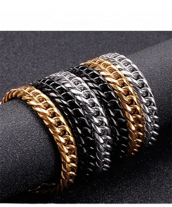 Close-up of 9mm stainless steel curb chains in gold, black, and silver on display
