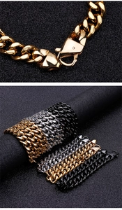 Close-up of lobster clasp detail and Cuban link chains in gold, silver, and black finish