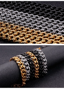Close-up of polished stainless steel Cuban link bracelets in gold, silver and black