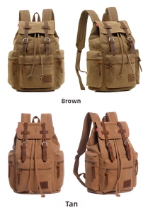 Detail view of vintage canvas backpacks in brown and tan with leather straps and drawstring