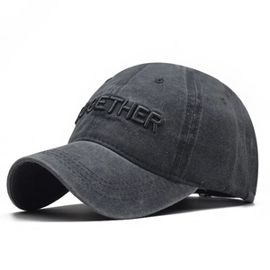 Detailed macro of 3D TOGETHER embroidery on vintage washed cotton baseball cap