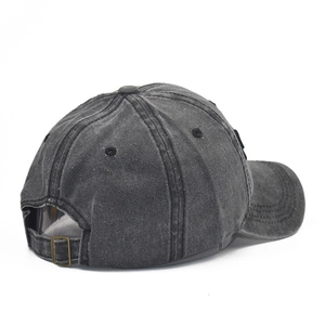 Detail of vintage washed cotton baseball cap with adjustable metal buckle and stitching
