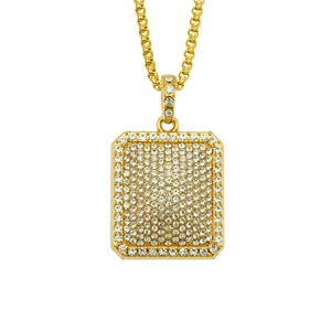 Macro shot of gold rectangle pendant necklace with sparkling clear cubic zirconia stones