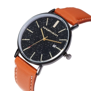 Macro view of men's starry black dial watch with leather strap and date window detail