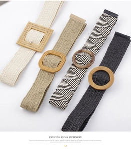 Close-up of four woven PP straw belts with various wooden and resin buckles on white