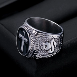 Retro stainless steel cross ring with hand of god embossing on black jewelry stand