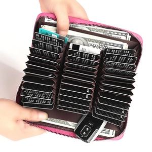 Detail of rose red leather card wallet showing multi-slot interior for cards and cash