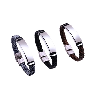 Three minimalist braided leather bracelets with stainless steel plates in grey black and brown