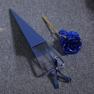 Detailed view of a blue 24K gold foil rose with matching gift box and love ribbon