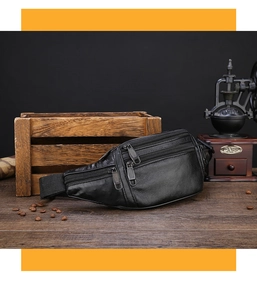 Macro shot of black pebbled leather texture and multi-layer zippers on men's waist bag