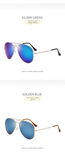 Detail of aviator sunglasses in silvery green and golden blue reflective mercury lenses