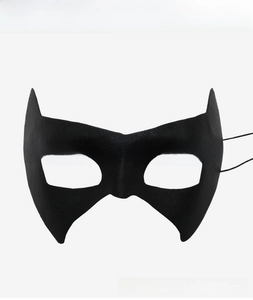 Close-up of black superhero eye mask with matte texture and elastic strap for cosplay