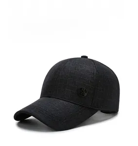 Detailed view of the dark grey textured fabric and circular RZG logo on the baseball cap