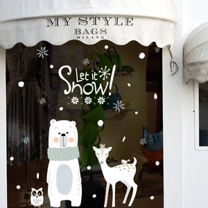 Christmas window stickers featuring polar bear, deer and snowflakes for shop display