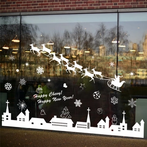 White Christmas window decals with Santa sleigh, reindeer, and snowflakes silhouettes