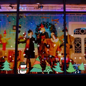Festive Christmas tree wall stickers with snowman and snowflake designs on a glass window