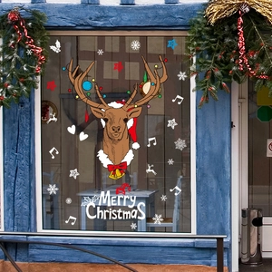 Sticker mural de renne de Noël avec flocons de neige sur cadre de fenêtre bleu