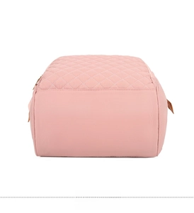 Flat base view of pink quilted nylon diaper bag showing bottom texture and side stitching