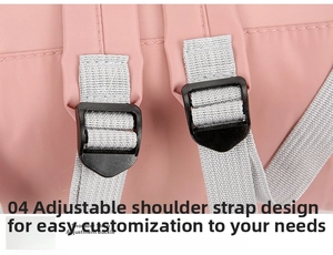 Detail view of pink nylon backpack featuring adjustable shoulder strap with plastic buckle