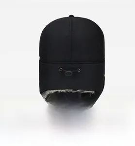 Back view of a black winter trapper hat with adjustable elastic drawstring and faux fur lining