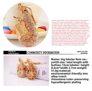 Macro detail of golden lobster keychain with sparkling Czech rhinestones and zinc alloy finish