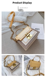 Detail of yellow and beige contrast crossbody bag with chain strap and gold hardware