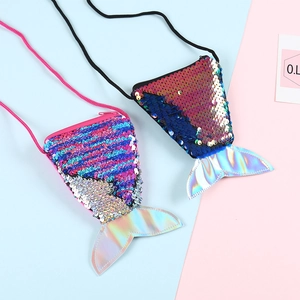 Detail of reversible sequins and laser material on mermaid tail coin purses for kids