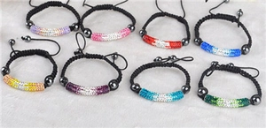 Variety of handmade adjustable woven bracelets with sparkling rhinestone tubes in multiple colors