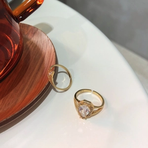 Close-up of S925 sterling silver gold-plated ring showing S925 hallmark and heart zircon