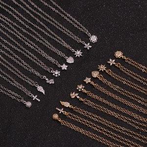 Fashionable zircon flower necklaces and assorted charms on dark background display